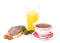 Bread with chocolate, tea and orange juice Royalty Free Stock Photo
