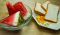 Bread and chopped watermelon on a wooden board. Royalty Free Stock Photo