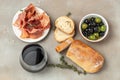 Bread ciabatta, jamon ham serrano paleta iberica, olives. Italian food ingredients, Restaurant menu, dieting, cookbook recipe top Royalty Free Stock Photo