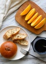 Bread, coffee, fruit on the table, rich breakfast Royalty Free Stock Photo