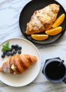 Bread, coffee, fruit on the table, rich breakfast Royalty Free Stock Photo
