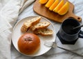 Bread, coffee, fruit on the table, rich breakfast Royalty Free Stock Photo