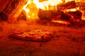 Bread Cooking on Burning Stone Hearth Floor