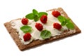 Bread crisp with fresh strawberries, soft cheese and mint