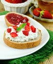 Bread with curd cream and strawberry jam Royalty Free Stock Photo