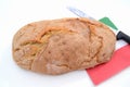 Bread with cutter Royalty Free Stock Photo