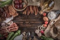 Bread with delicious pieces of sliced ham, sausage, tomatoes, salad and vegetable - Meat platter with selection - Cutting sausage Royalty Free Stock Photo