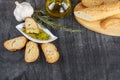 The bread dipped in olive oil with olive. Greek olive oil bread dip. Olive oil sauce in white bowl Royalty Free Stock Photo