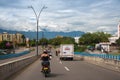 Bread distribution truck on a street with motorcycles circulating in the city of Neiva. Colombia.