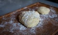 Bread dough  on floured board ,making bread rolls at home. hobby Royalty Free Stock Photo