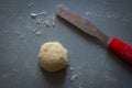 Bread dough  on floured board  with pallet knife.,making bread rolls at home Royalty Free Stock Photo