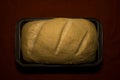 The bread dough has risen, the bread dough is ready for baking. Homemade yeast bread from white flour in a square baking dish. Royalty Free Stock Photo