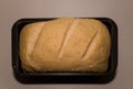 The bread dough has risen and ready for baking. Homemade yeast bread from white flour in a square baking dish. Royalty Free Stock Photo