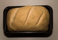 The bread dough has risen and ready for baking. Homemade yeast bread from white flour in a square baking dish. Royalty Free Stock Photo