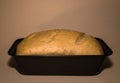 The bread dough is ready for baking. Homemade yeast bread from white flour in a square baking dish. World homemade food Royalty Free Stock Photo