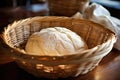 bread dough proofing in a rattan basket Royalty Free Stock Photo