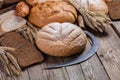 Bread, ears and sickle on old boards