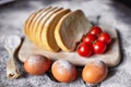 Bread, flour, eggs and cherry tomatoes. Royalty Free Stock Photo