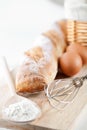 Bread, flour, eggs and kitchen utensil Royalty Free Stock Photo