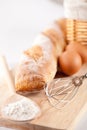 Bread, flour, eggs and kitchen utensil Royalty Free Stock Photo