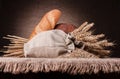 Bread, flour sack and ears bunch still life