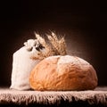 Bread, flour sack and ears bunch still life Royalty Free Stock Photo