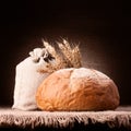 Bread, flour sack and ears bunch still life