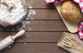 bread with flour sack, rolling pin and wheat ears on wooden background Royalty Free Stock Photo