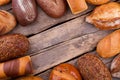 Bread frame on wooden background. Royalty Free Stock Photo