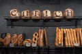 Bread and french baguette for sale at local bakery, dark grey background, rustic style healthy nutritious food