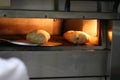 Bread freshly made. Out of a traditional brick oven. process of making bread Royalty Free Stock Photo