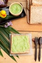 Bread with green custard and fresh milk.