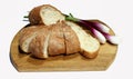 Bread and green onion on the cutting board on the white background,isolated. Royalty Free Stock Photo