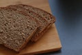 Bread, health, diet, slice up, natural nutrition. Slices of homemade bread on the wooden board. Dark bread