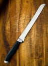 Bread Knife on Wooden Board Royalty Free Stock Photo