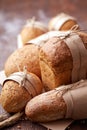 Bread loaf rustic selection of rye, soda, bloomer breads, with granary and oated rolls and ears of wheat. Royalty Free Stock Photo