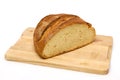 Bread loaf on wooden cutting board