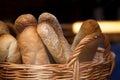 Bread loaves and baguettes in a wicker basket. Royalty Free Stock Photo