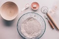 Bread-making tools. Bread ingredients flour, salt, water and banneton