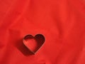 Bread molds stainless Heart shaped on fabric red background, love Valentine Day for copy text card, background Royalty Free Stock Photo