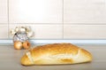 Bread onion and garlic on the countertop Royalty Free Stock Photo