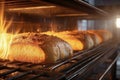 Bread in the oven at a bakery. Production and baking of fresh bread. Industrial furnace. Baking bread. Fire, smoke and steam.