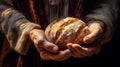 Bread in the overworked hands of an old woman. Helping a poor person. Close-up.