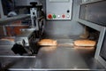 Bread packaging process on a conveyor belt Royalty Free Stock Photo