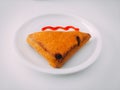 Bread Pakoda with tomato sauce. Indian tea time snack prepared from Potatoes and chillies. A common street food or fast food snack Royalty Free Stock Photo