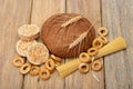 Bread, pasta and pastries on wooden background