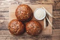 Bread products with cereals and seeds on a wooden background. Lean healthy buns, carbohydrate pastries Royalty Free Stock Photo