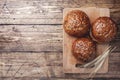 Bread products with cereals and seeds on a wooden background. Lean healthy buns, carbohydrate pastries. Copy space Royalty Free Stock Photo