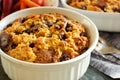 Bread pudding in a white ramekin close up