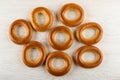 Bread rings baranka scattered on wooden table. Top view Royalty Free Stock Photo